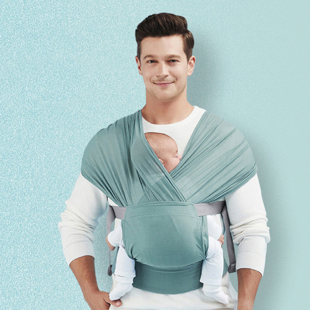 Newborn Hugging Baby